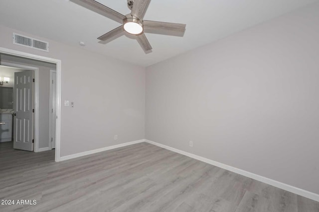 unfurnished room featuring ceiling fan and light wood-type flooring