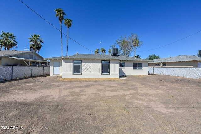 rear view of property with central air condition unit