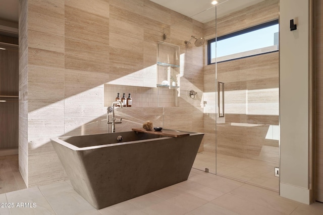 kitchen featuring tile walls and light tile patterned floors