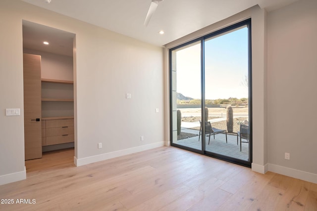 spare room featuring light hardwood / wood-style floors