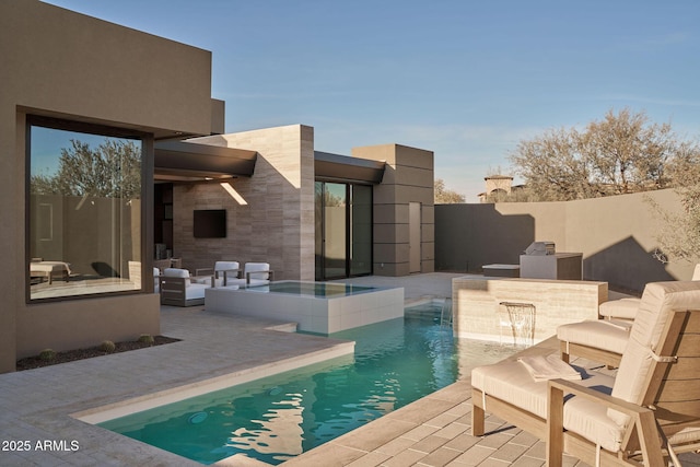 view of swimming pool featuring area for grilling, a patio, and an in ground hot tub