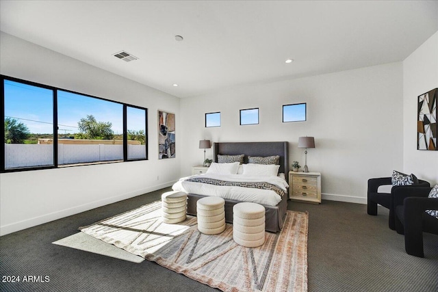 bedroom featuring dark carpet