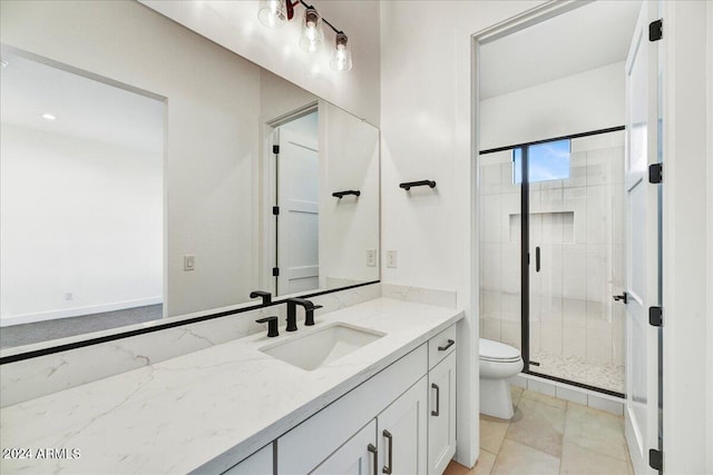 bathroom with vanity, toilet, a shower with shower door, and tile patterned flooring