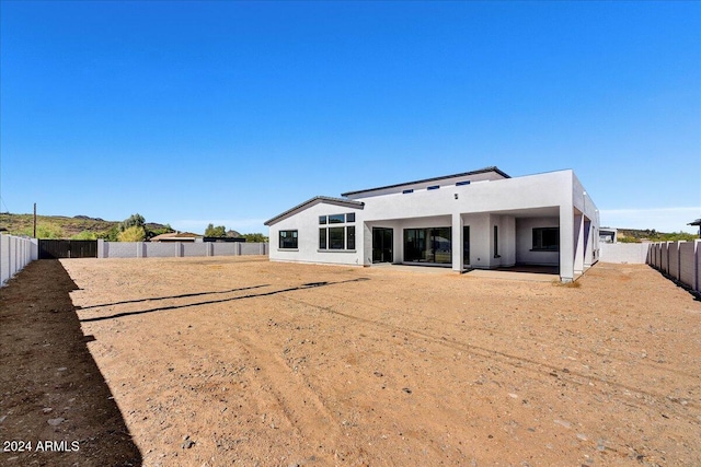 back of property featuring a patio area