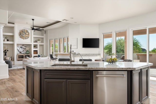 3946 N Pinnacle Hills Cir, Mesa, AZ 85207 - kitchen featuring dishwasher, open floor plan, a ceiling fan, light wood-style floors, and light stone counters