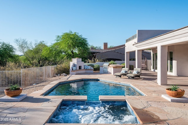 3946 N Pinnacle Hills Cir, Mesa, AZ 85207 - view of swimming pool featuring a patio area, exterior kitchen, and a pool with connected hot tub