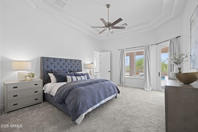 3946 N Pinnacle Hills Cir, Mesa, AZ 85207 - carpeted bedroom featuring a raised ceiling, access to exterior, and ceiling fan