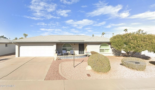 ranch-style house featuring a garage