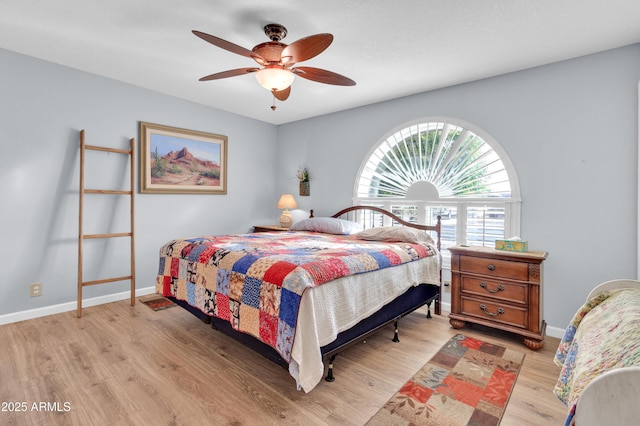 bedroom featuring ceiling fan and light hardwood / wood-style floors