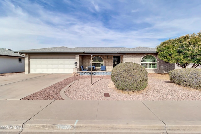 ranch-style home featuring a garage