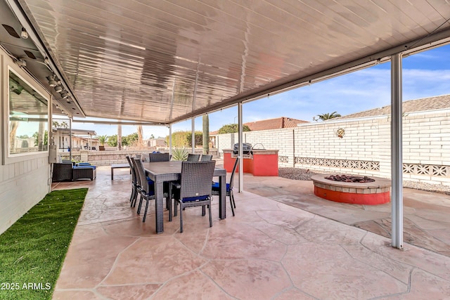 view of patio with a fire pit