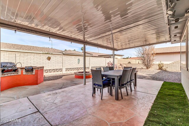 view of patio featuring exterior kitchen