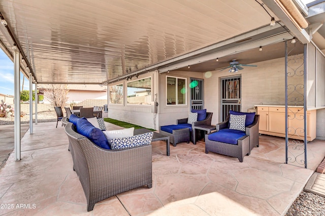 view of patio featuring outdoor lounge area and ceiling fan