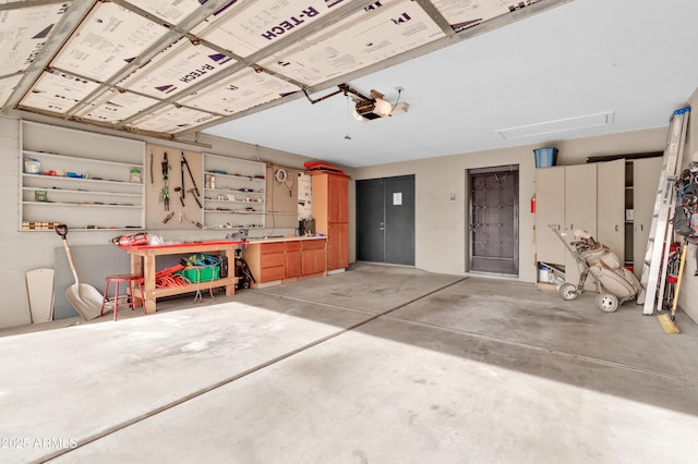 garage featuring a workshop area and a garage door opener