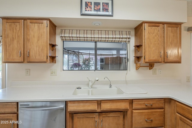 kitchen with brown cabinetry, dishwasher, light countertops, open shelves, and a sink