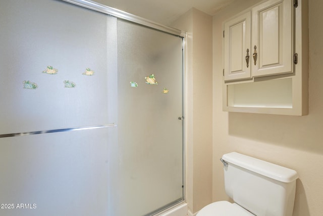 full bath featuring toilet and a shower stall