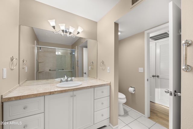 bathroom featuring vanity, wood-type flooring, and toilet