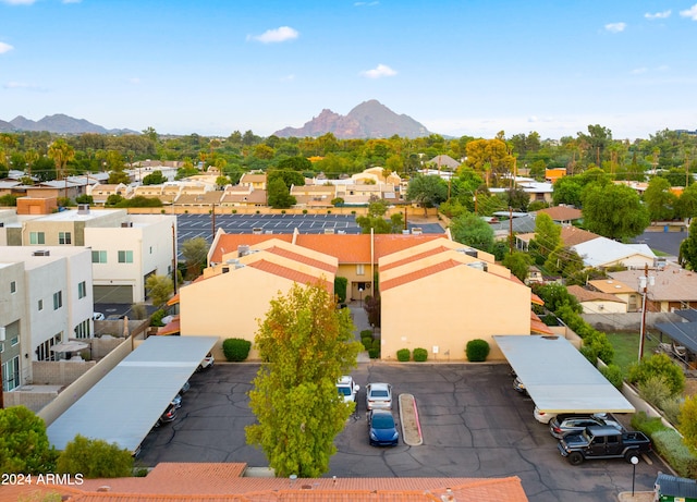 birds eye view of property with a mountain view