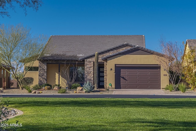 view of front facade with a garage and a front yard