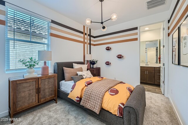 3343 S Lily Ave, Mesa, AZ 85212 - bedroom featuring light colored carpet, ensuite bathroom, and a chandelier