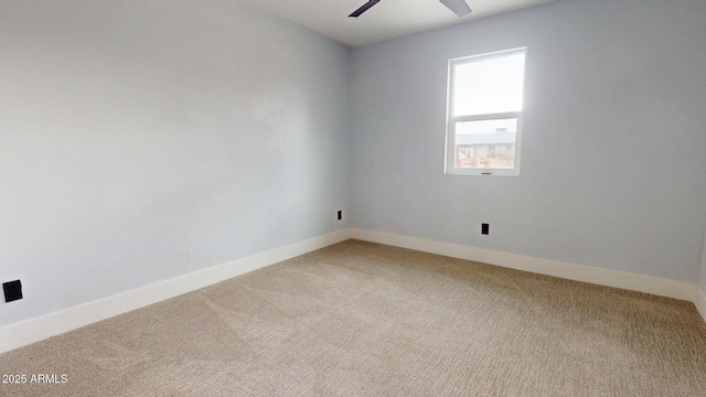 carpeted empty room with ceiling fan