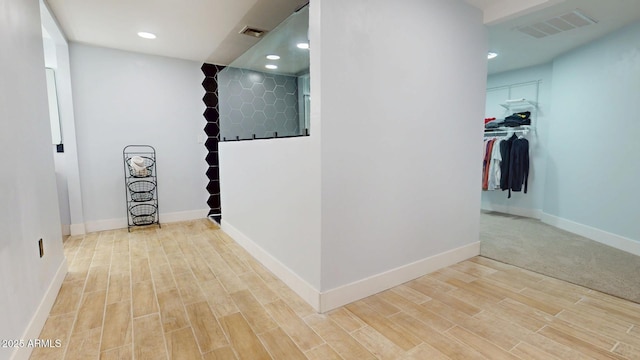 corridor featuring hardwood / wood-style flooring