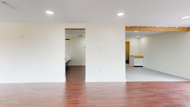 empty room with wood-type flooring