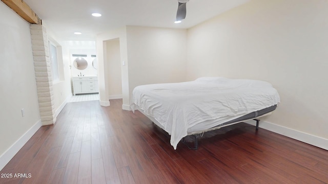 bedroom with dark wood-type flooring