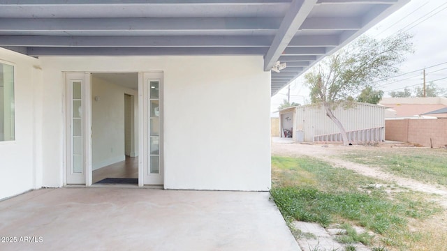 doorway to property with a patio