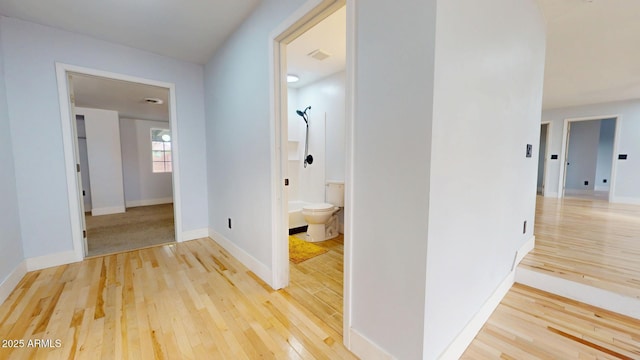 corridor featuring hardwood / wood-style floors