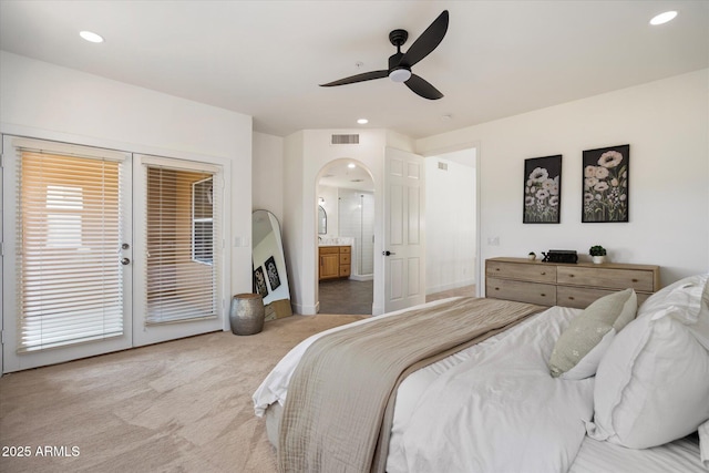 bedroom with access to outside, recessed lighting, ensuite bath, visible vents, and carpet