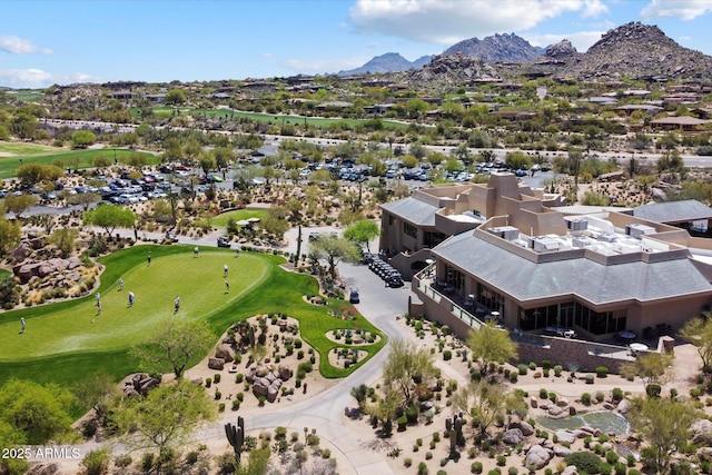 bird's eye view with golf course view and a mountain view