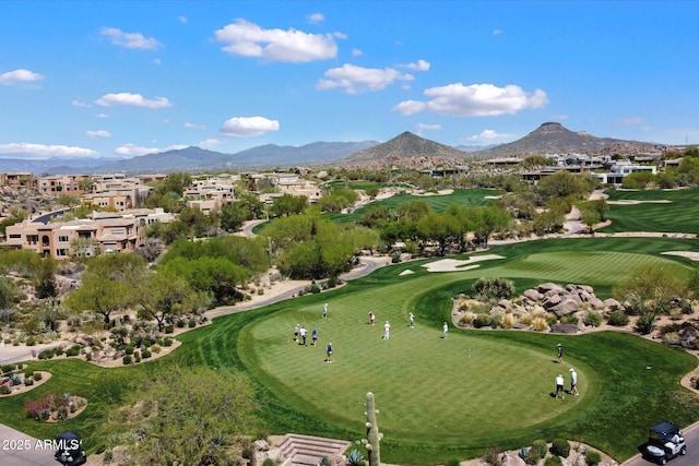 surrounding community featuring a mountain view and view of golf course
