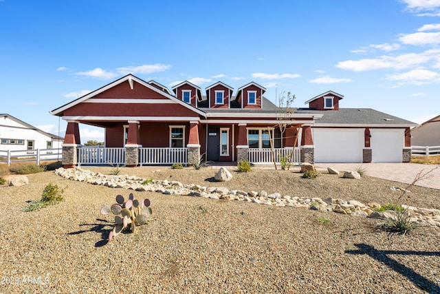 craftsman-style house featuring a porch and a garage