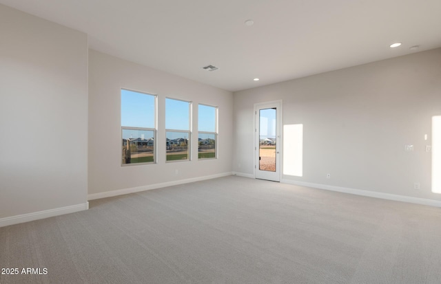 26696 W Siesta Ln, Buckeye, AZ 85396 - spare room featuring baseboards, recessed lighting, and light colored carpet