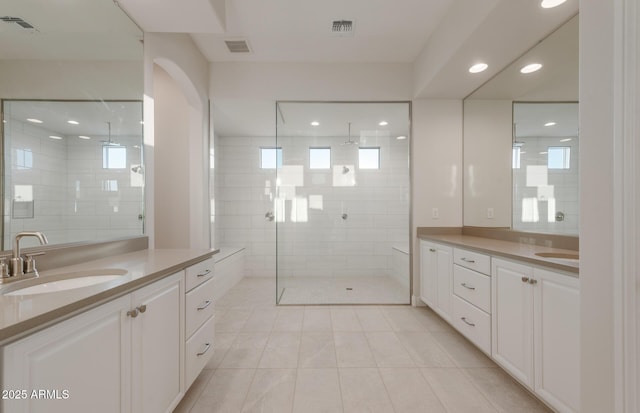 26696 W Siesta Ln, Buckeye, AZ 85396 - full bath with a sink, visible vents, and two vanities