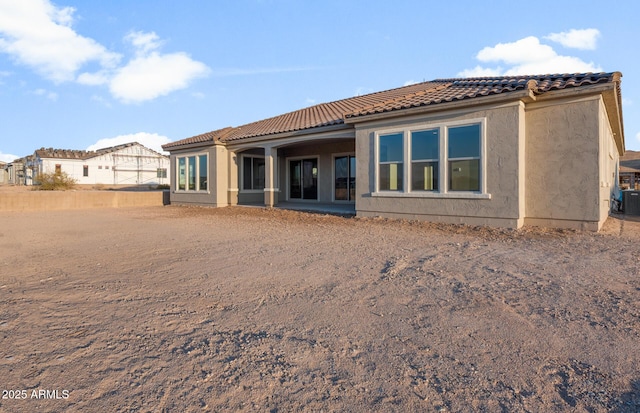 26696 W Siesta Ln, Buckeye, AZ 85396 - back of house featuring a tile roof and stucco siding