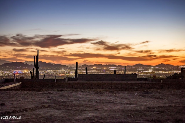 yard at dusk with a mountain view