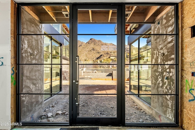 doorway to outside featuring a mountain view