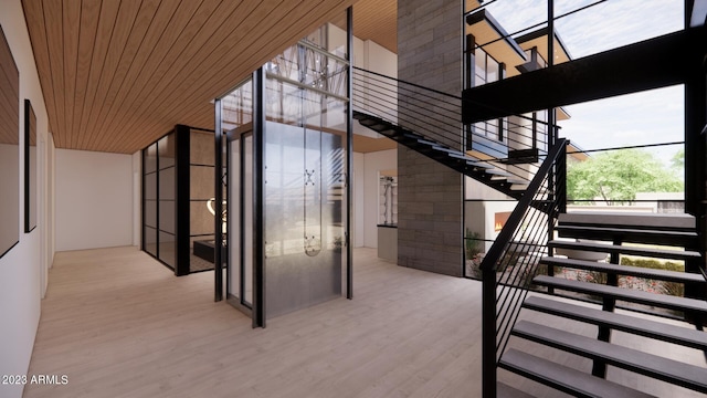 stairway with wood-type flooring and wood ceiling