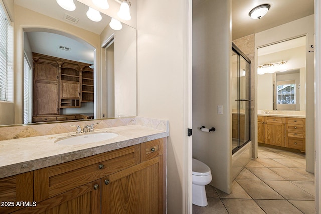 full bathroom with toilet, tile patterned flooring, visible vents, and vanity