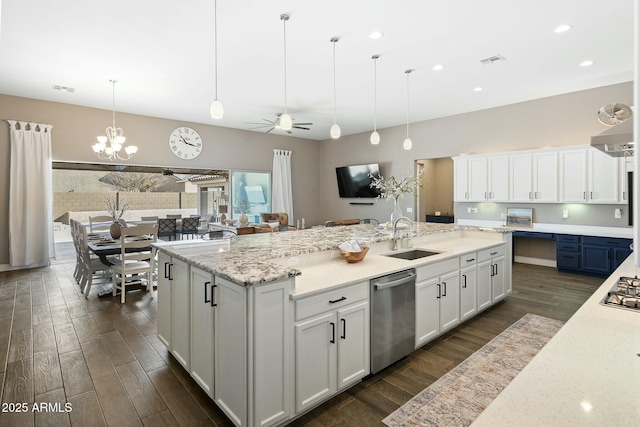 kitchen with dark wood-style floors, visible vents, appliances with stainless steel finishes, and a sink