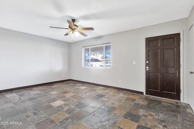 interior space featuring a textured ceiling and ceiling fan