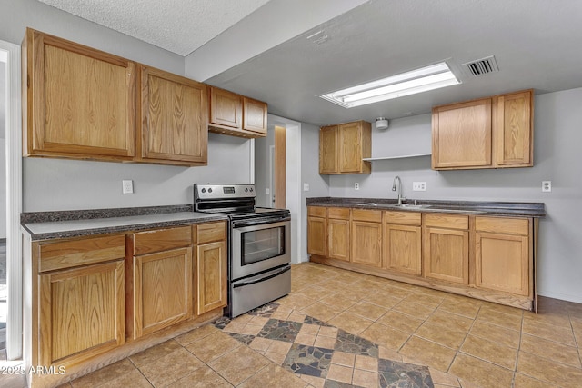 kitchen with sink, stainless steel electric stove, a textured ceiling, and light tile patterned flooring