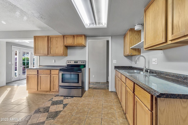 kitchen with sink, light tile patterned floors, a textured ceiling, stainless steel range with electric cooktop, and french doors