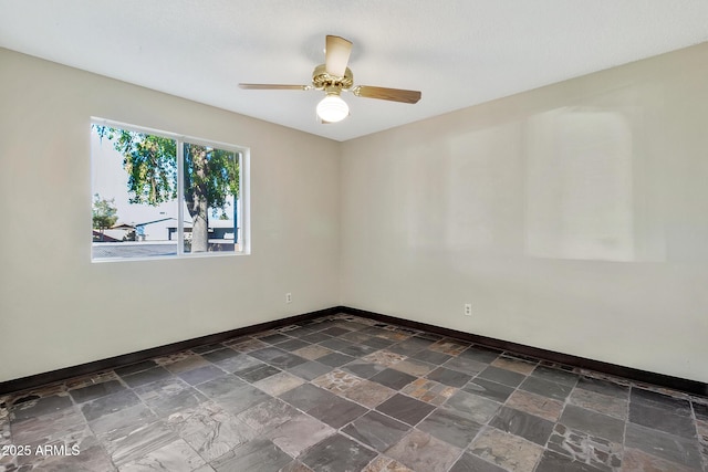 unfurnished room with ceiling fan