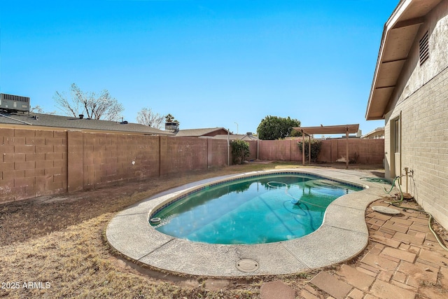 view of swimming pool featuring a patio area and central air condition unit