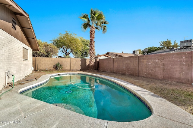 view of pool featuring central air condition unit