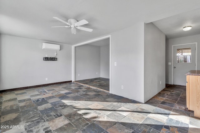 unfurnished room featuring ceiling fan and a wall mounted AC