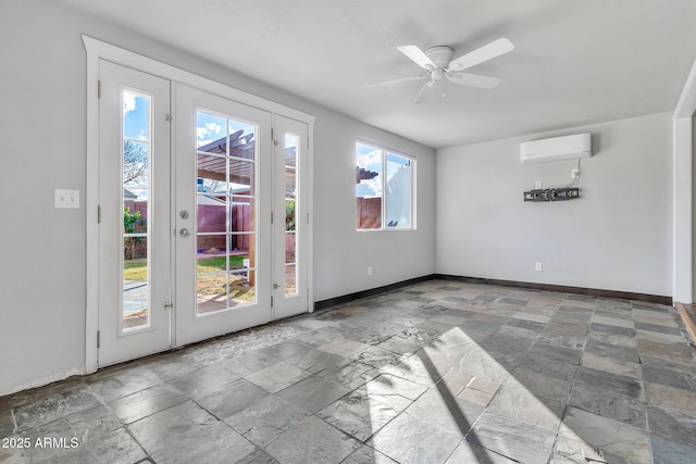 entryway featuring a wall unit AC and ceiling fan